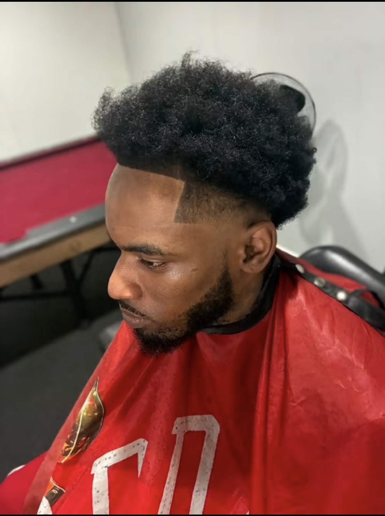 Interior of Grind4itCuts barber shop with a vintage barber chair